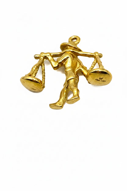 18 kt yellow gold charm Man Carrying Rice