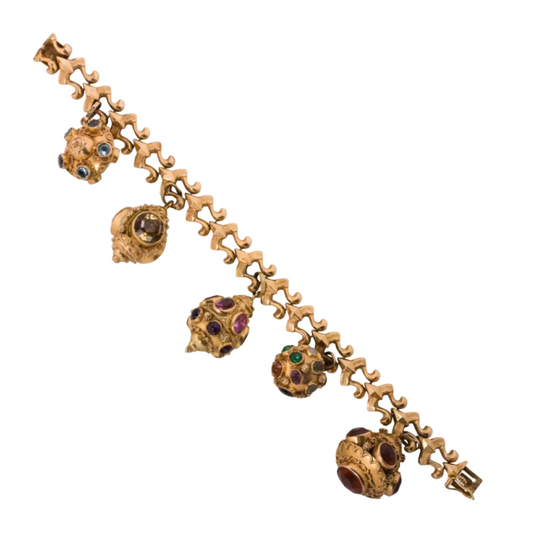 A MULTI-GEM AND 18K GOLD OVER-SIZED CHARM BRACELET